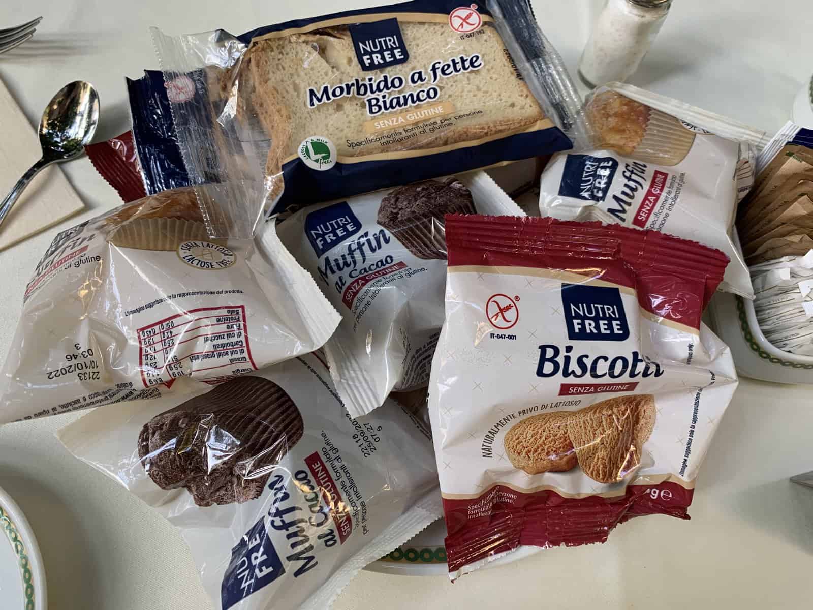 gluten-free breakfast treats, pre-packaged, including biscotto cookies, muffins and bread