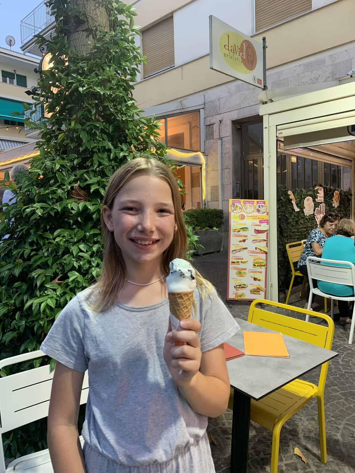 Miss E enjoying gluten-free gelato in a cone