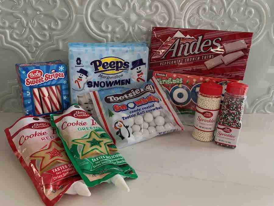gluten-free candy-cane-sticks, snowmen peeps, tootsie roll snow balls, Andes candy cane chocolate, Christmas dots, red & green cookie icing, white pearl sprinkles and red & green sprinkles