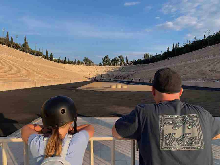 the back of Miss E's and Dave's heads as the look at the marble Panathenaic Stadium