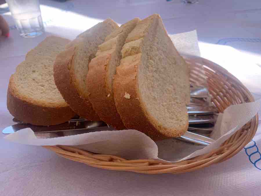 regular gluten-filled bread in a basket with "clean" silverware underneath