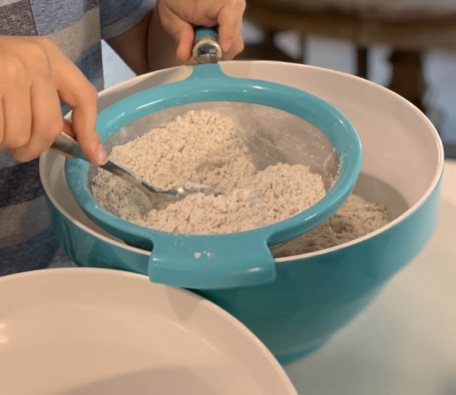 sifting gluten-free flour and ingredients