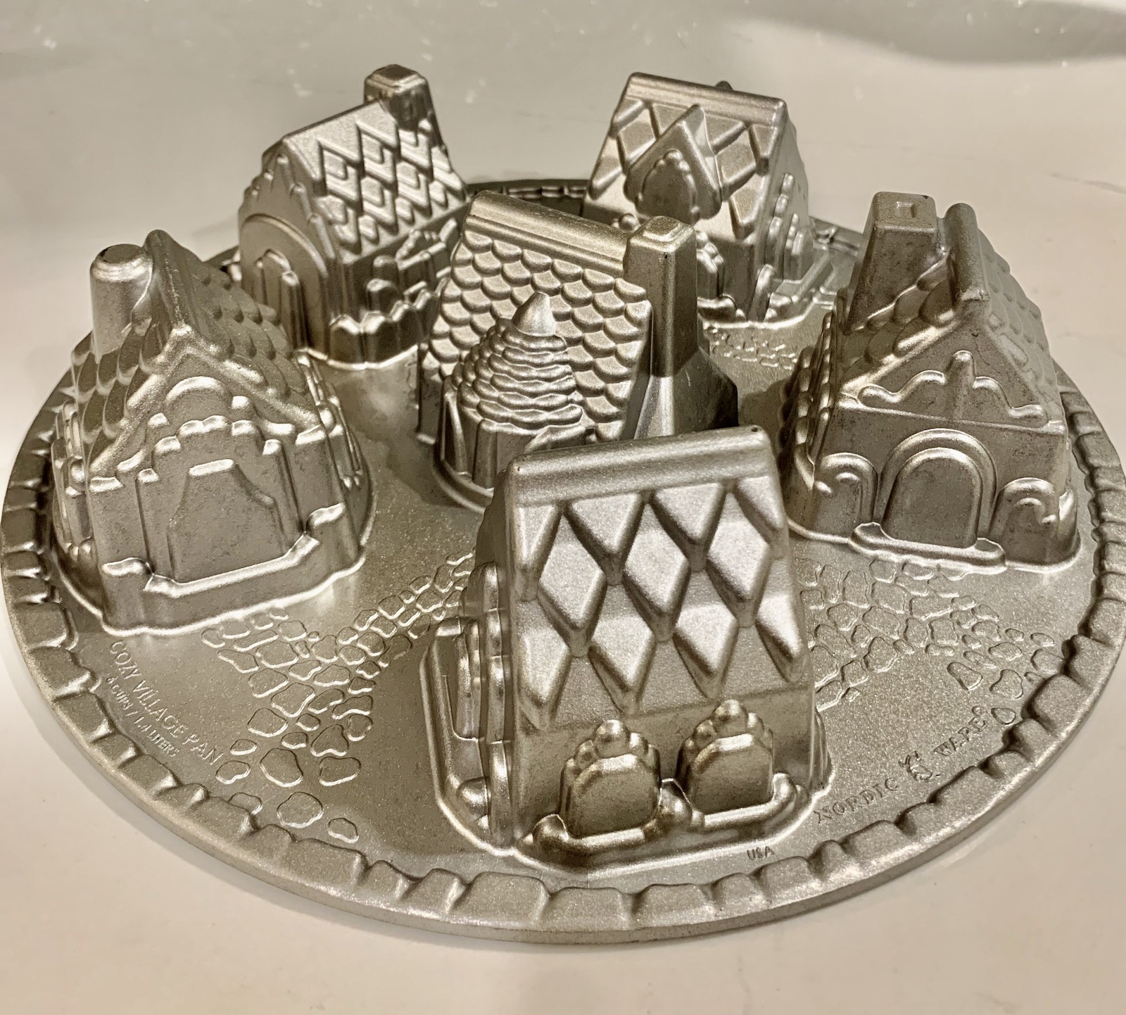 mini gingerbread house pan with wells for five individual gingerbread house cakes