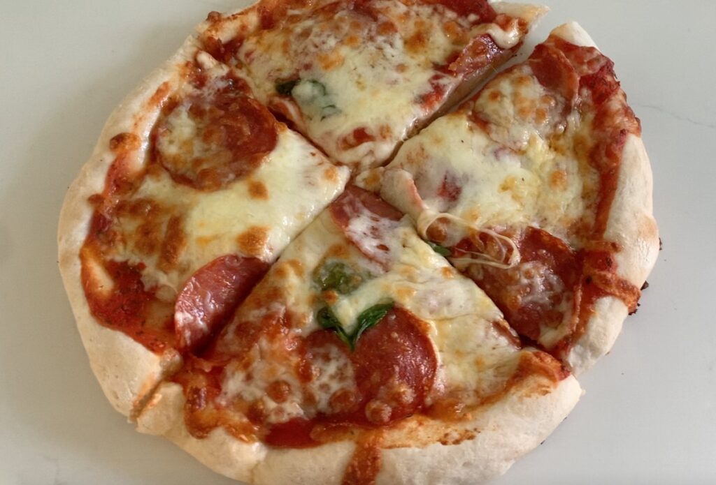 gluten-free pizza crust made with, Caputo Fioreglut gluten-free flour, topped with tomato sauce, mozzarella, pepperoni, and olives