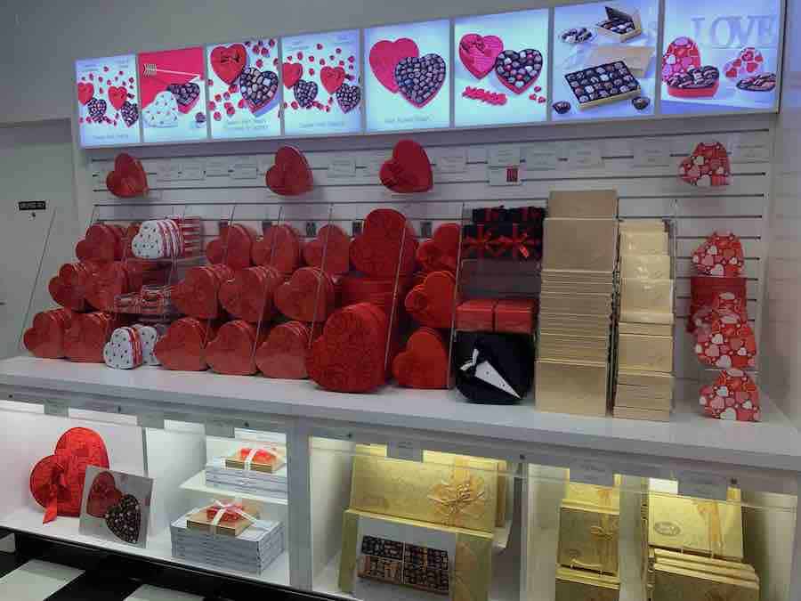 a Valentine's display at See's Candies, include red heart boxes of chocolates