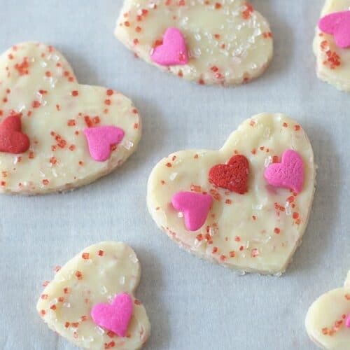 white chocolate fudge in heart shapes with valentine's sprinkles
