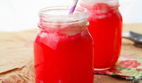 two mason jars with pink punch