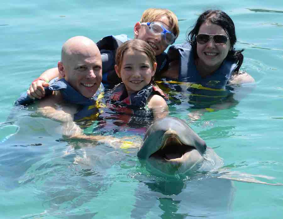 Dave, Miss E, CJ & Heather and a dolphin in the water.... all smiling