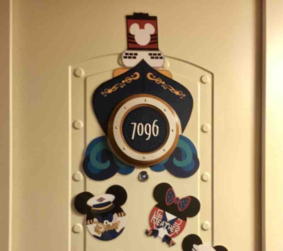 decorations for the cruise ship door, ship cut out surrounding door #7096, Mickey & Minnie heads with Dave and Heather's names