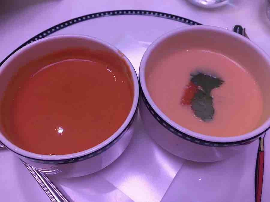 2 gluten-free soup bowls on plate (left is tomato soup, right is bisque)