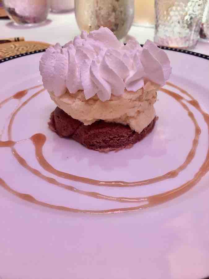 gluten-free cake, topped with ice cream, topped with whipped cream