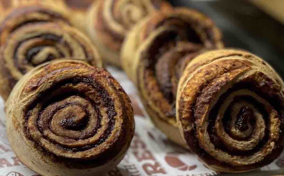 gluten-free Hungarian "snail" (pinwheel-style) pastries in a display case