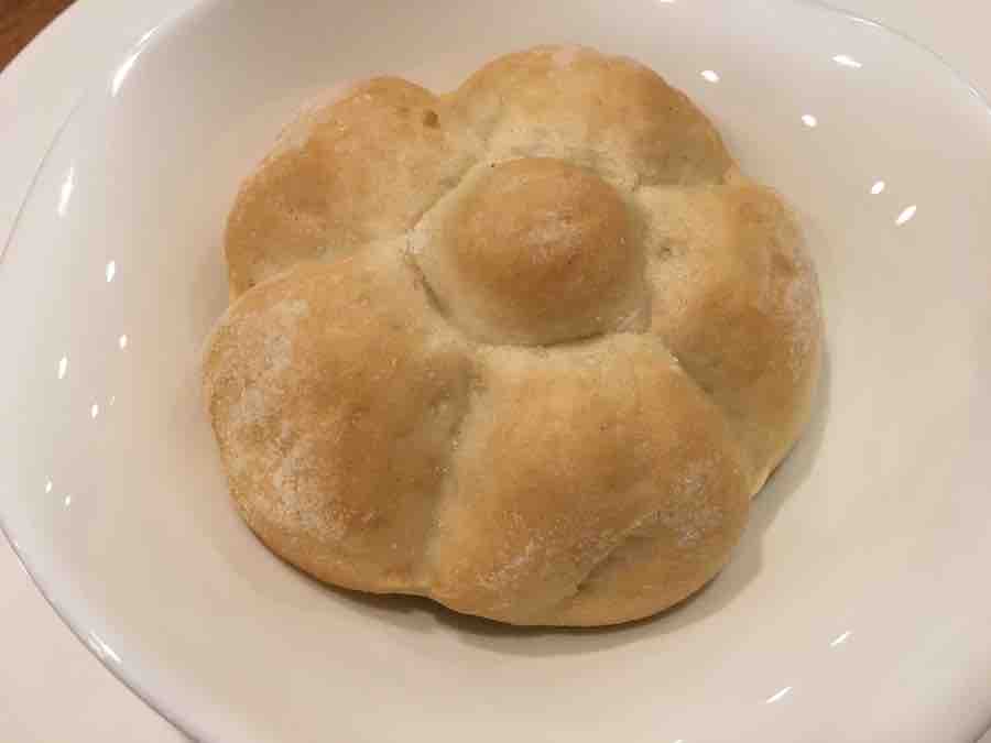 gluten-free Schar rosette roll on a white plate