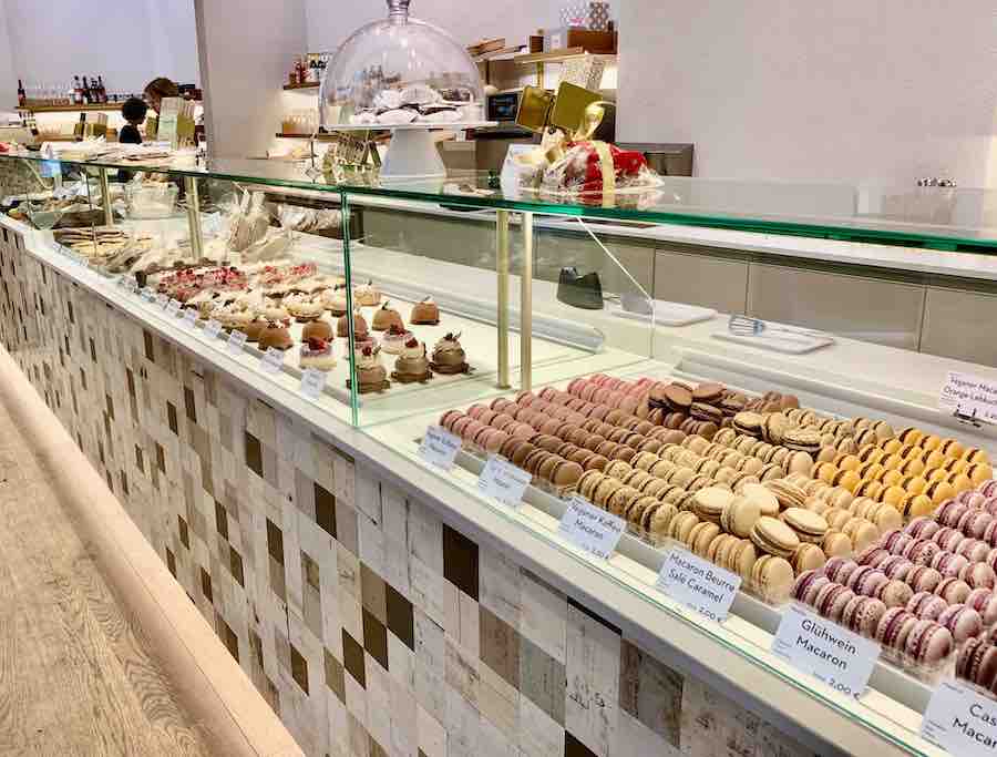 gluten-free bakery counter with a display of macarons and pastries