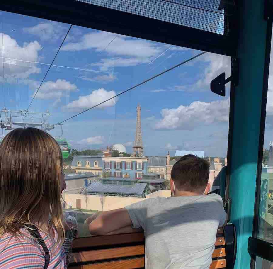 Miss E & CJ getting a glimpse of Epcot from the Skyliner (Eiffel Tower in the background)