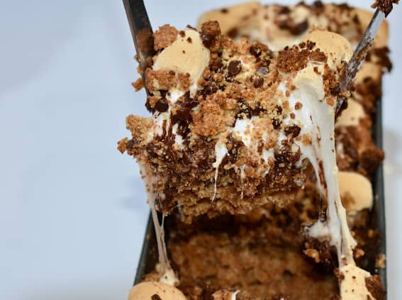 a piece of Gluten-Free S’mores Cake with stretch marshmallow