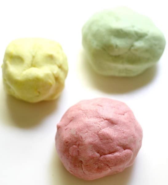 3 all-natural gluten-free play doh balls in pale yellow, pale green & pink