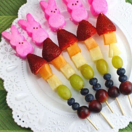 fruit skewers with grapes, pineapple, cantaloupe, strawberries and pink bunny peeps on top