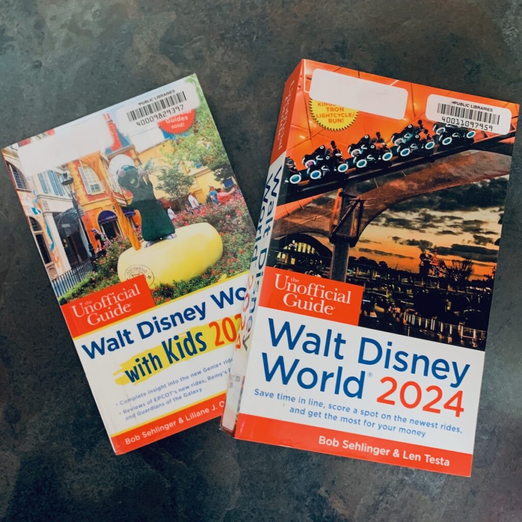 2 books on a table: Walt Disney World with Kids and Walt Disney World 2024