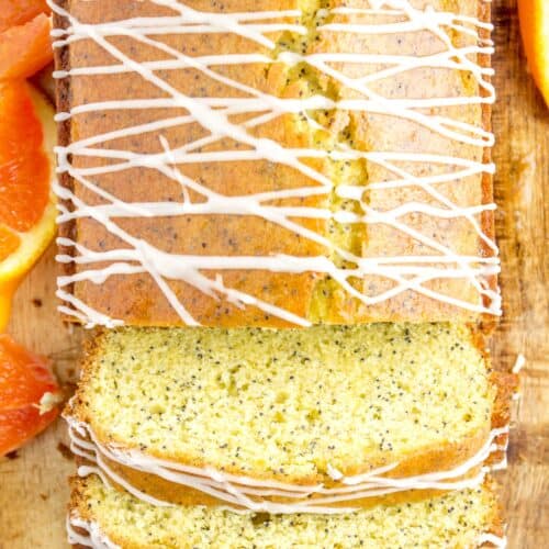 Gluten Free Orange Poppyseed Bread with three slices cut, frosting drizzled on top