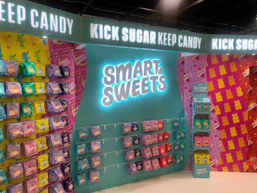 trades how display of "Smart Sweets" with display of candy and text "Kick Sugar Keep Candy" and "Smart Sweets"