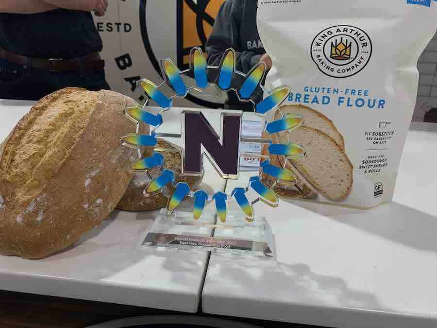 Nexty award in front of a loaf of gluten-free bread and a package of King Arthur gluten-free bread flour