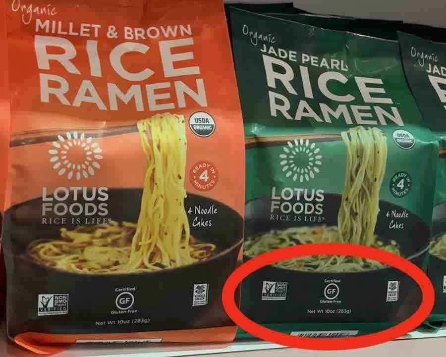 2 packages of gluten free rice ramen: orange package is millet & brown  rice ramen and green package is jade pearl rice ramen, the green package has a red circle highlighting front of package labeling of: non-gmo, gluten-free, and whole grain