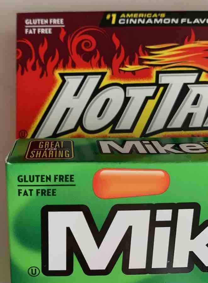 corners of packages of Hot Tamales and Mike & Ike candy showing the words "Gluten Free" on the package