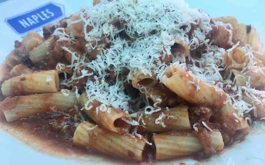 gluten-free rigatoni covered with parmesan cheese