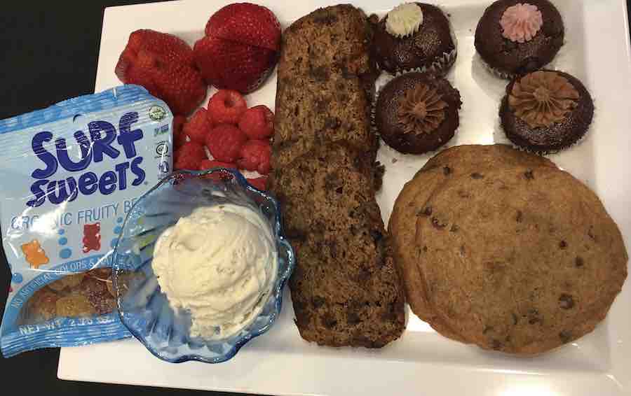 a gluten-free dessert plate: gummy bears, fruit, dessert bread, ice-cream, 4 mini cupcakes & chocolate chip cookies