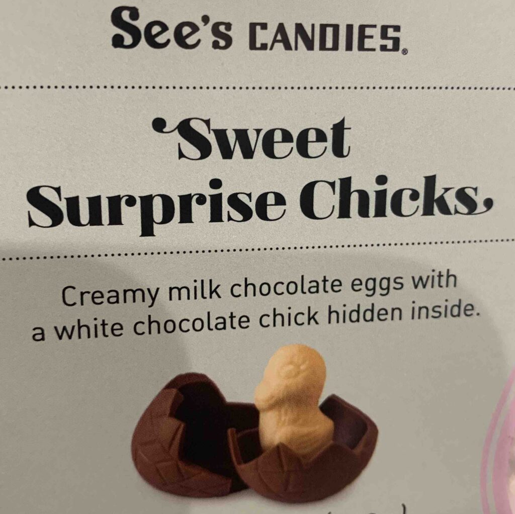 a label for "See's Candies Sweet Surprise Chicks" with a photo of a white chocolate chick popping out of a milk chocolate egg