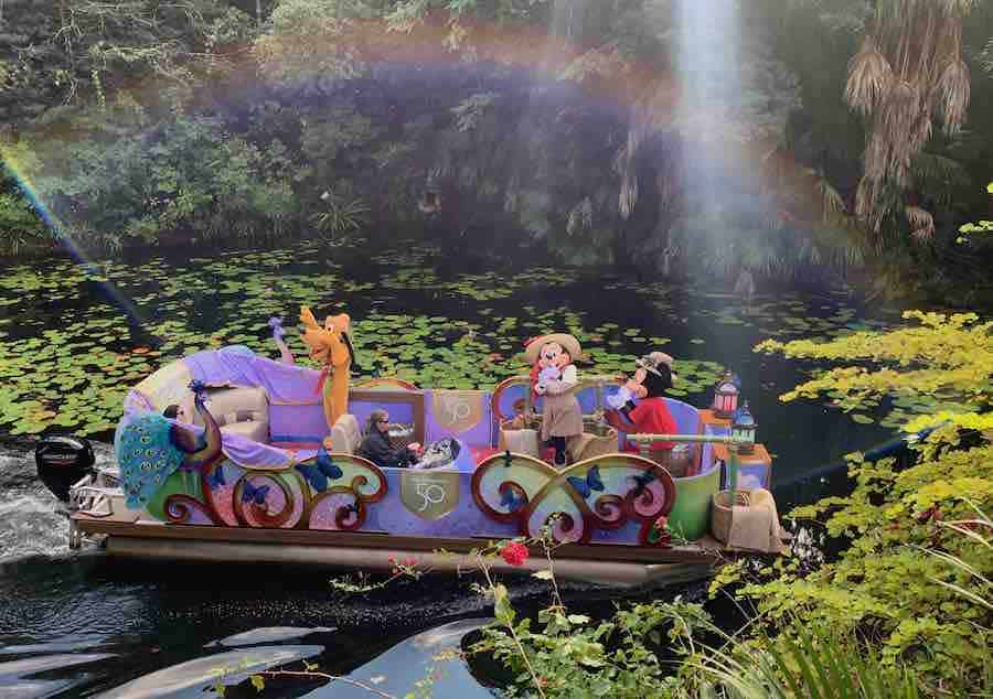 a boat with goofy, Minnie & Mickey... and a rainbow in the mist