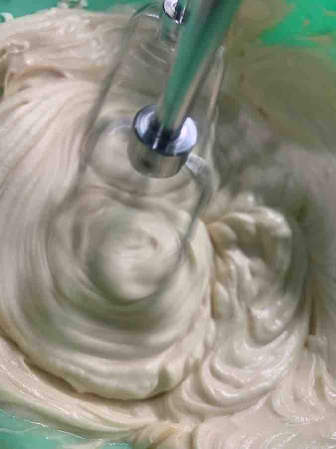 beaters in motion, beating cream cheese mixture