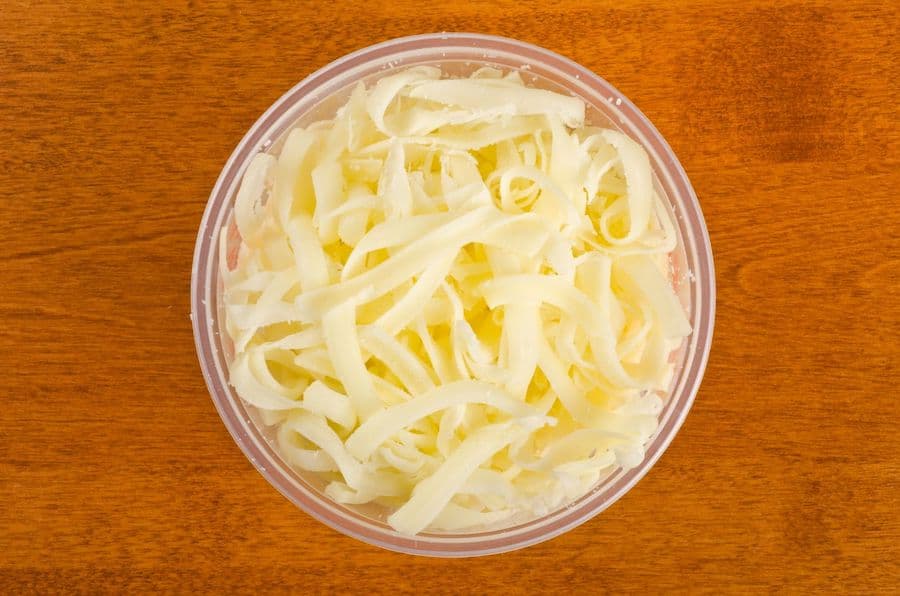 a bowl of shredded cheese
