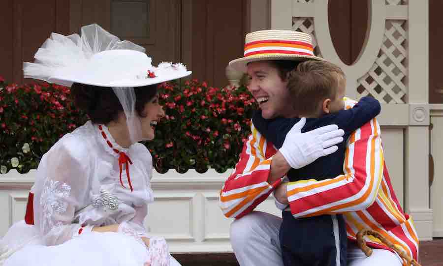 Mary Poppins & Bert looking at each other smiling while Bert is hugging CJ