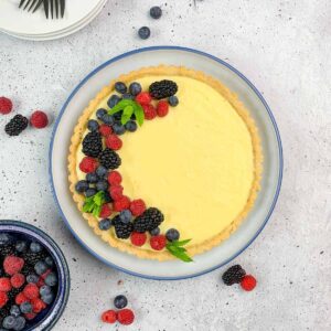 gluten-free lemon tart covered with berries