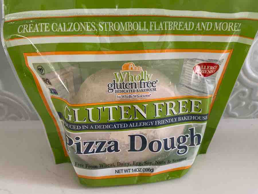 a package of Wholly Gluten Free gluten-free pizza dough on a white counter