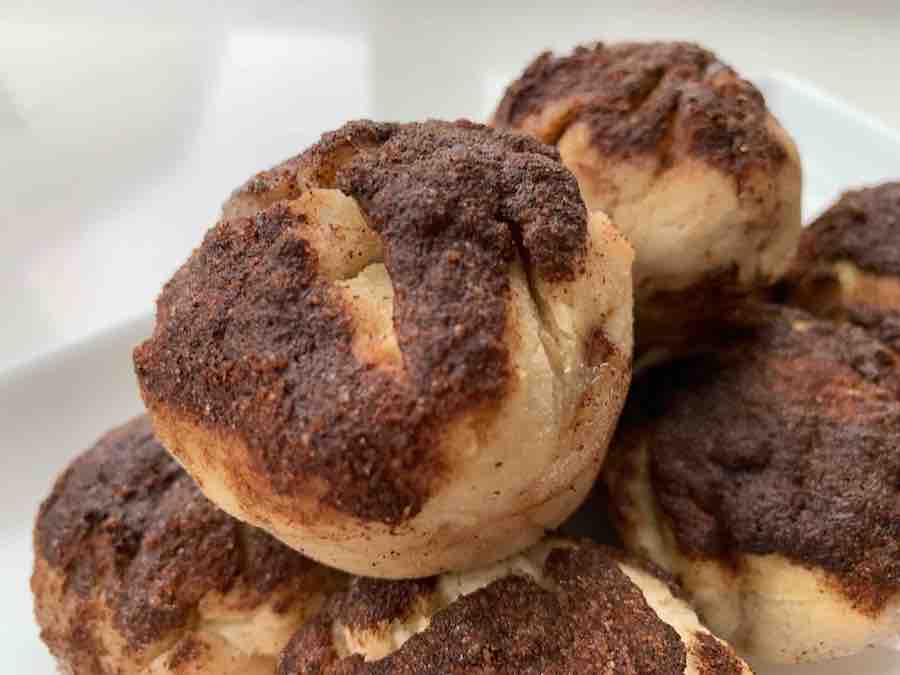 a pile of gluten-free resurrection rolls, with cinnamon sugar topping