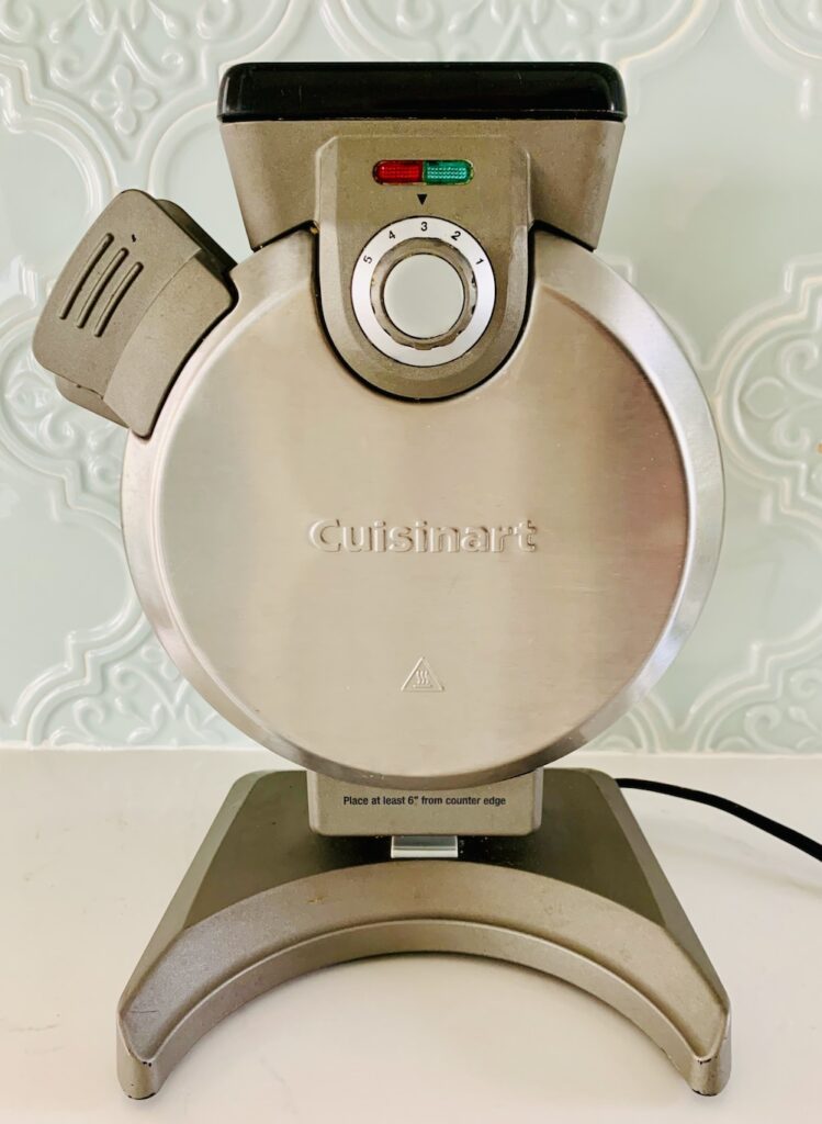 Cuisinart stand-up waffle maker on a counter.