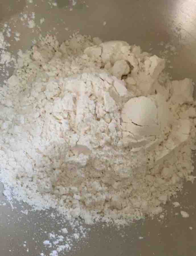 gluten-free wheat starch flour in a mixing bowl, top view