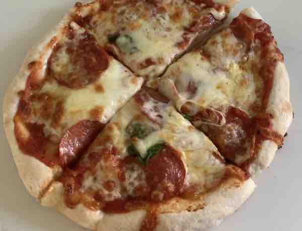 gluten-free pepperoni, cheese and basil pizza, top view