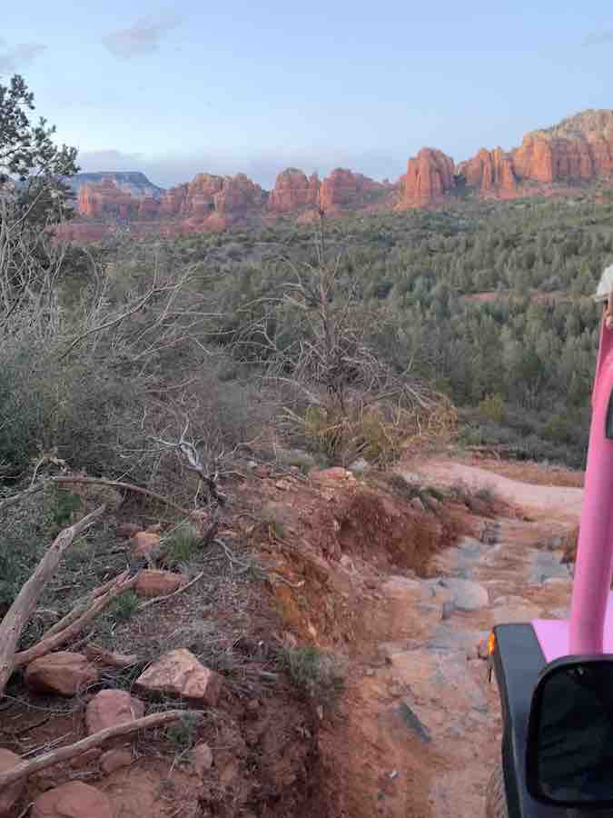 view of Sedona red rocks a rocky off-road path, from inside the pink jeep