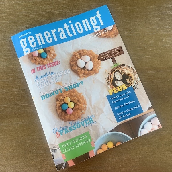 Magazine cover, White text on blue box:Spring 2023 Generationgf, image of birds nest cookies made of oatmeal and filled with candy eggs on parchment paper, More text: in this issue, a visit to the White House, can you work at a donut shop?, gluten-free Easter & Passover recipes, Can I outgrow celiac disease?, no bake vegan gluten-free bird nest cookies, plus what's new with generation gf, ask the dietician, meet a generation gf group