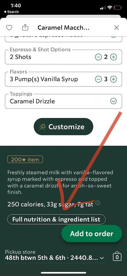 Screen shot of the starbucks app showing a red arrow pointing near the bottom of the screen at a button titled "full nutrition and ingredient list", other items on the screen include customization options for the drink (Caramel Macch) a description and an "add to order" button