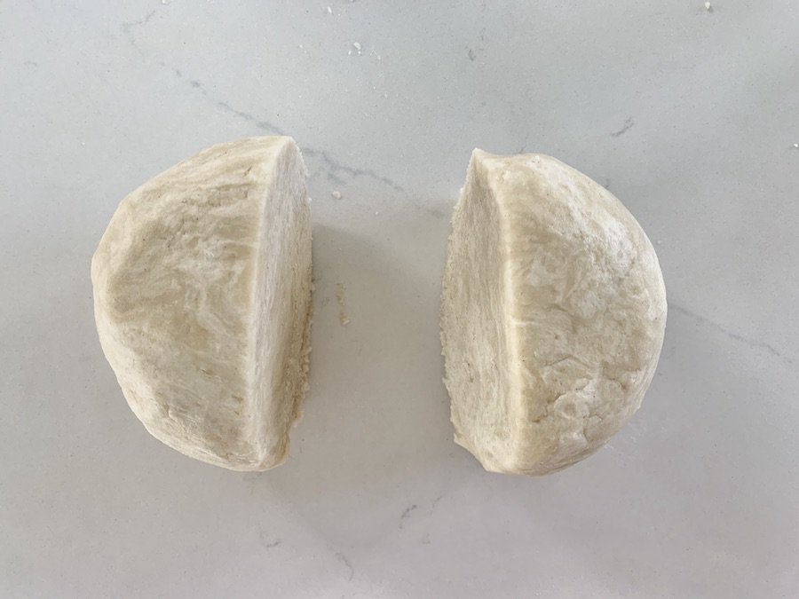 pie dough ball cut into two halves