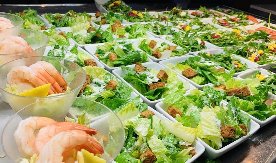 buffet of shrimp salad, Caesar salad and green salad