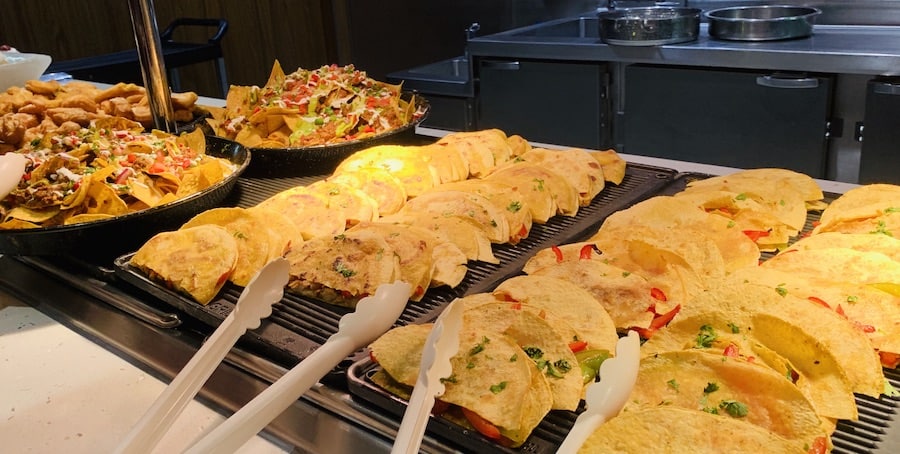 quesadillas and nachos on a buffet