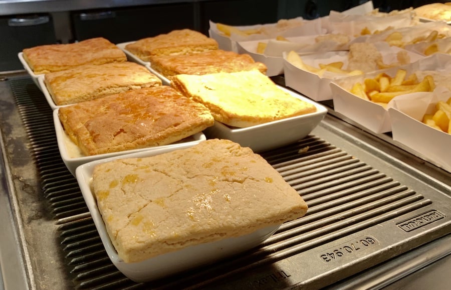 gluten-free chicken pot pie on a buffet, individual serving dishes covered with a square of gluten-free crust