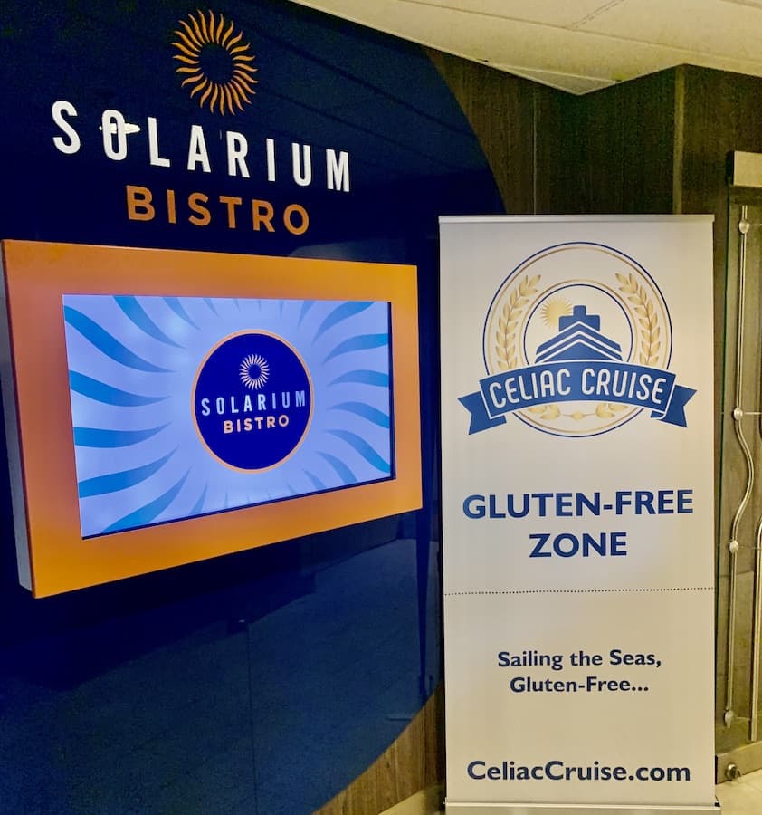 A sign outside the "Solarium Bistro" stating: Celiac Cruise, Gluten-Free Zone, Sailing the Seas, Gluten Free..., Celiaccruise.com