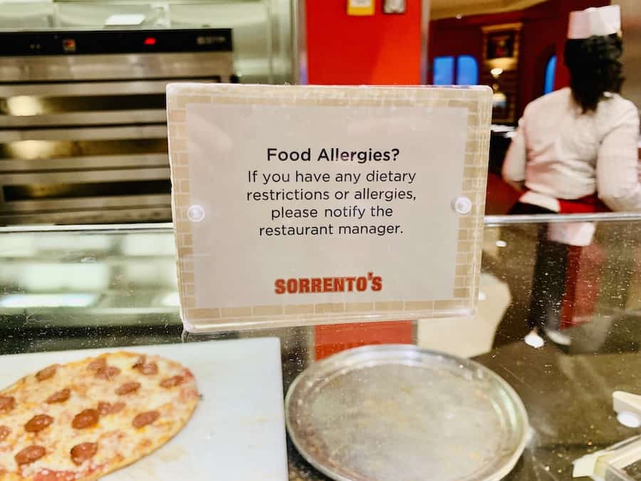 sign at Sorrento's pizza asking cruisers to notify restaurant manager of food allergies